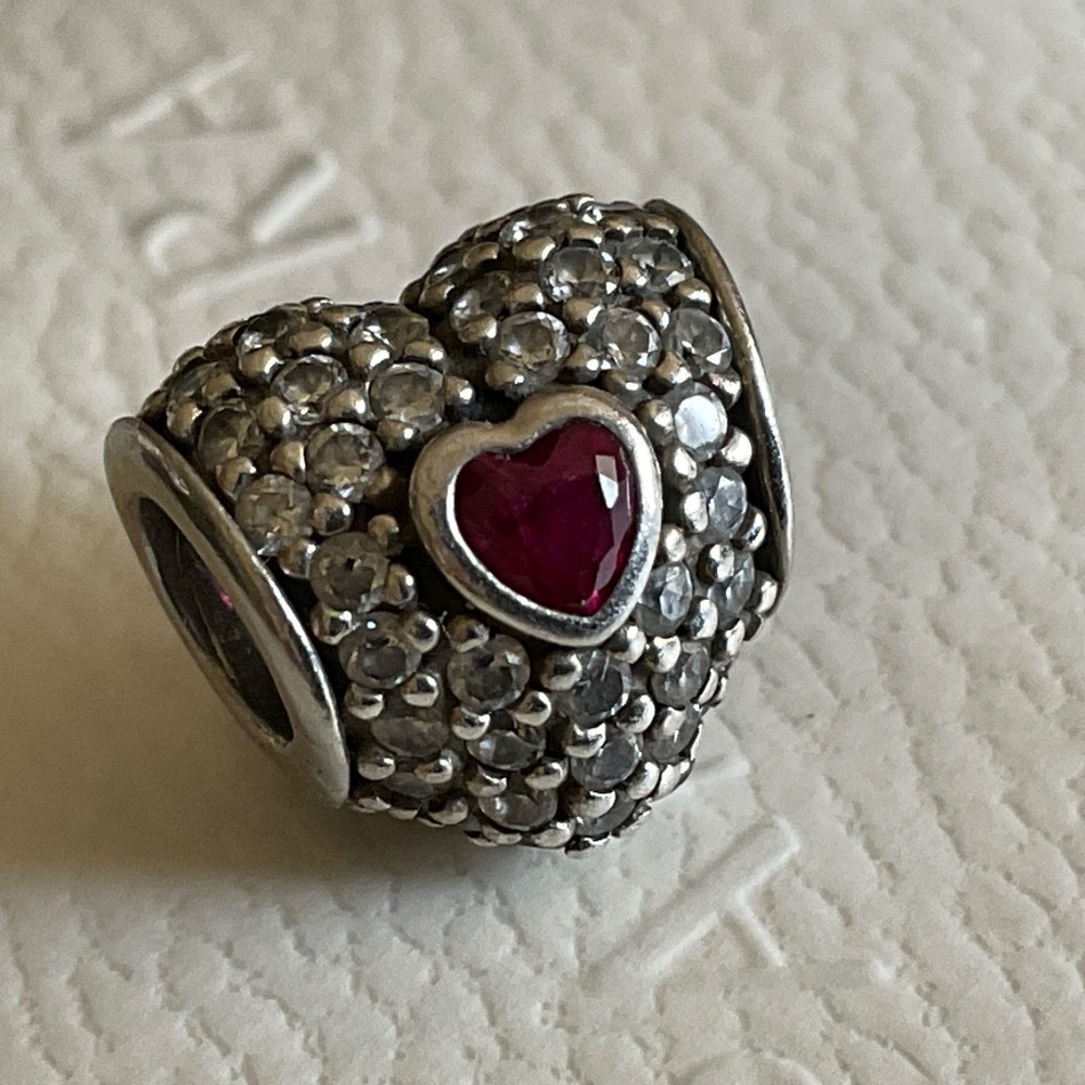 Pandora pave heart with one big red heart shape stone